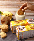 dipping banana cookie on milk