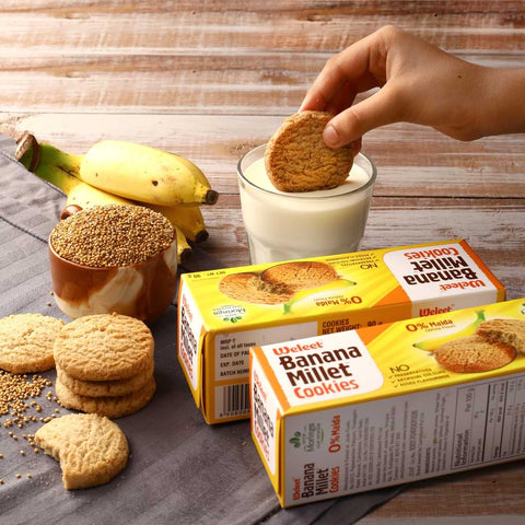 dipping banana cookie on milk